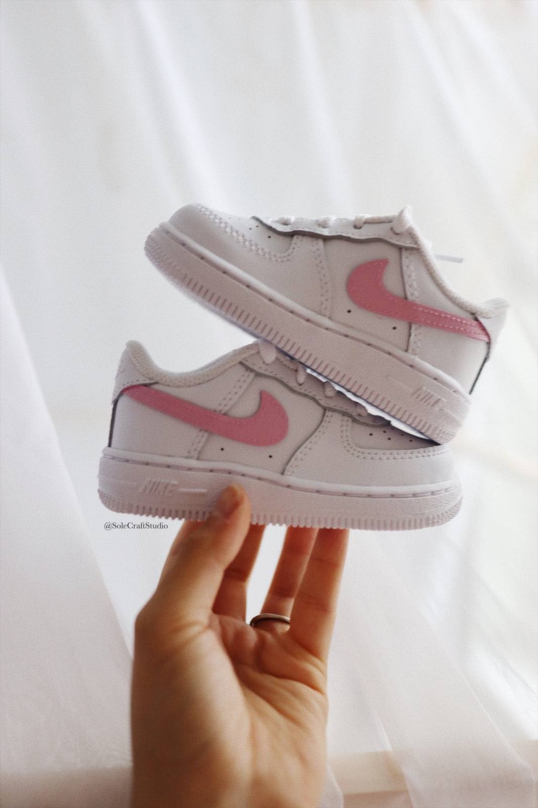 Air force ones pink swoosh online