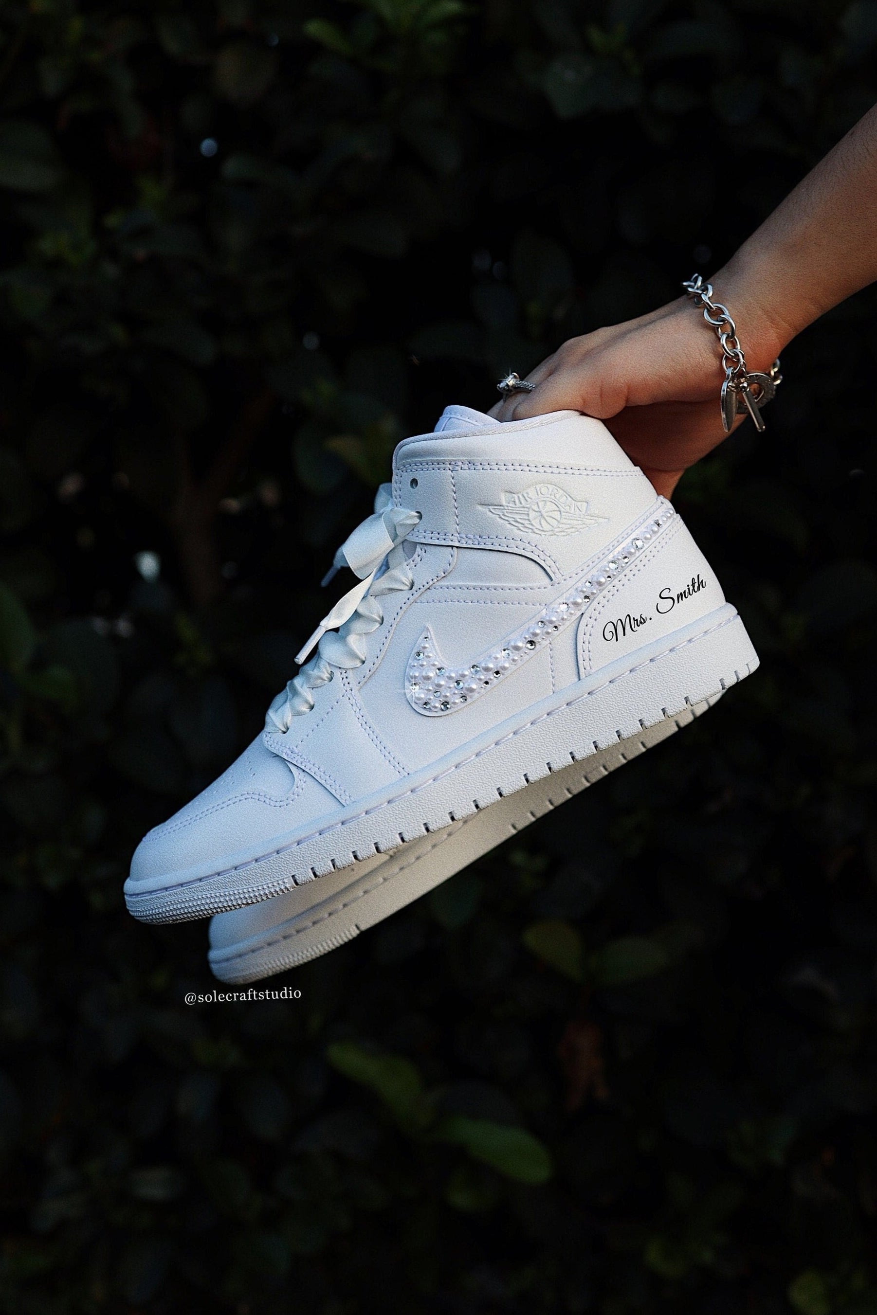 Wedding Sneakers for Bride Personalized Bridal Shoes Air Jordan 1 Mid Rhinestone Crystals and White Pearl Mix, In Hand, Side View